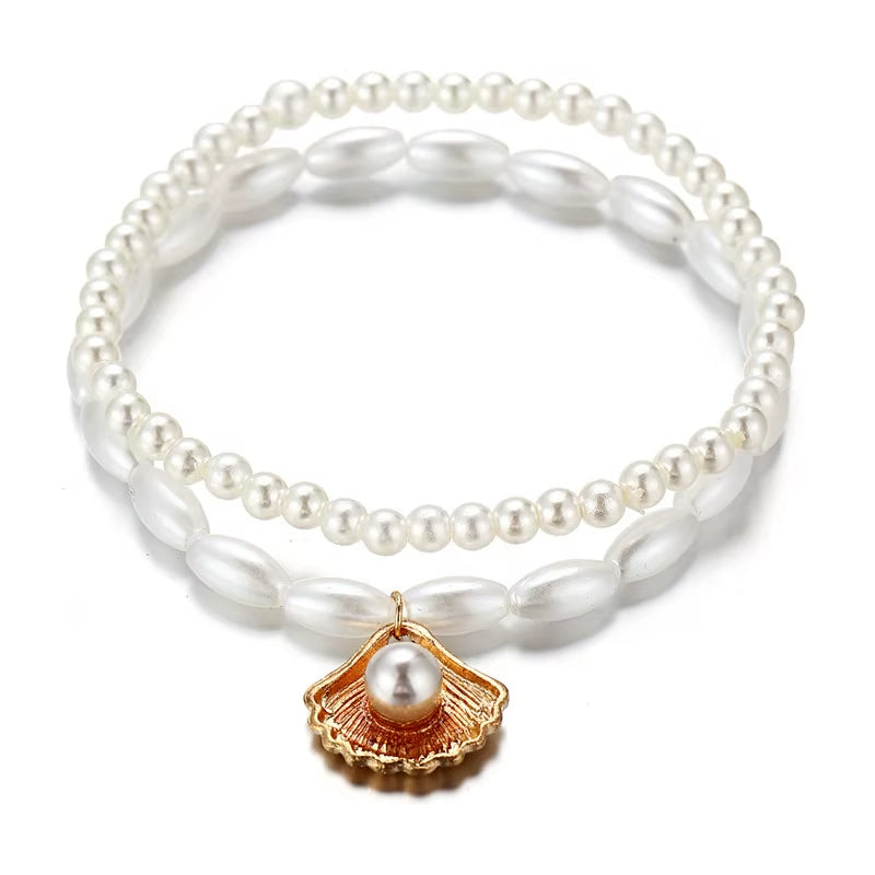 Bracelet Cheville Femme Pendentif Coquillage sur fond blanc