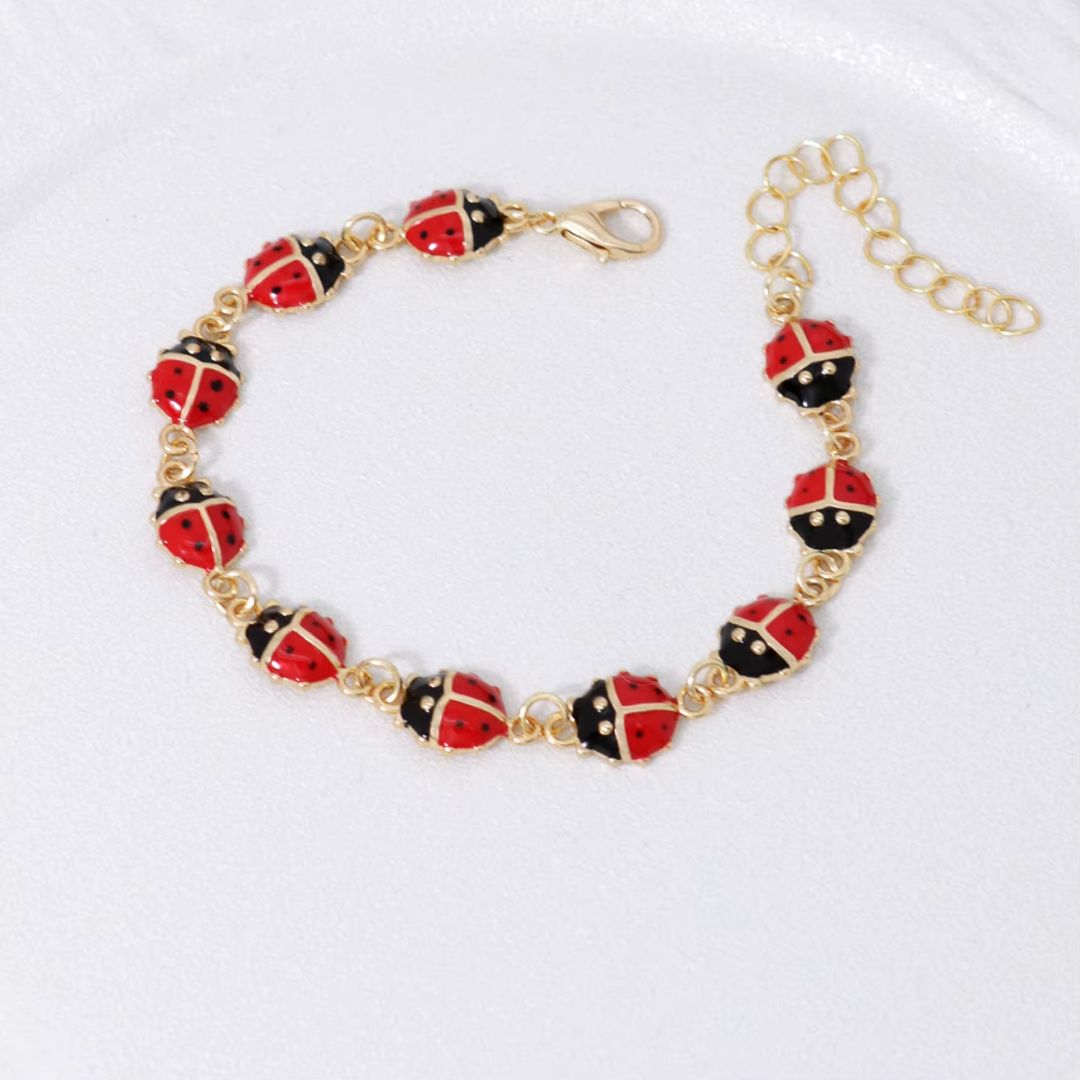 Bracelet Coccinelle en Cuivre sur fond gris