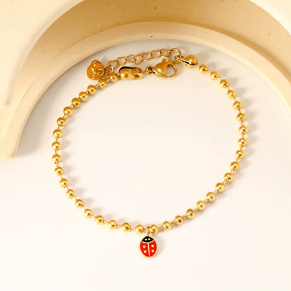 Bracelet Coccinelle Perles Dorées