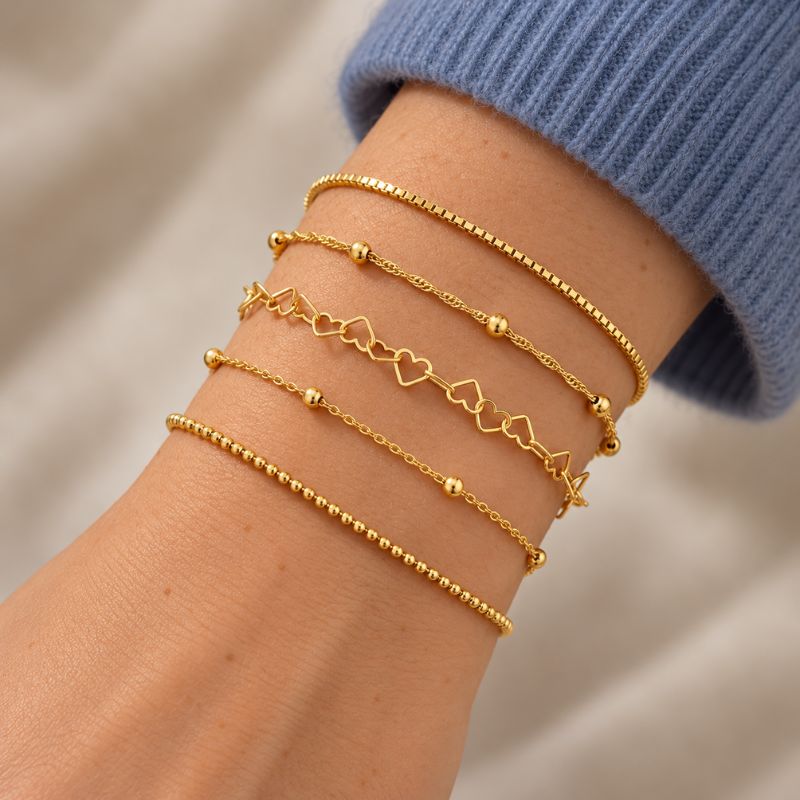 Bracelet Femme Multirang Superposés Et Cœurs Dorés